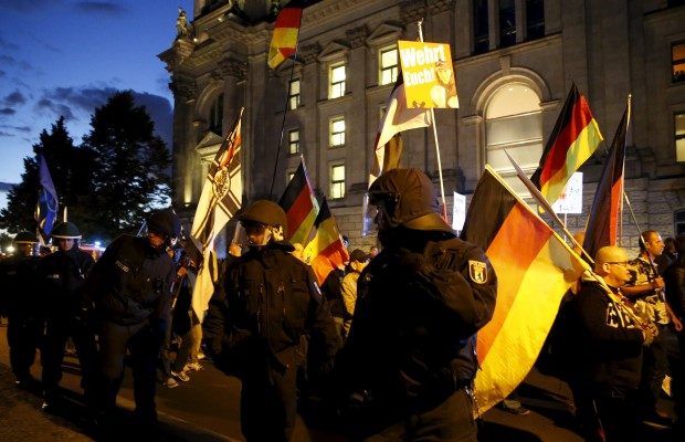 German police officers escort members of BAERGIDA, Berlin's section of anti-immigration movement Patriotic Europeans Against the Islamisation of the West (PEGIDA), during a rally in Berlin
