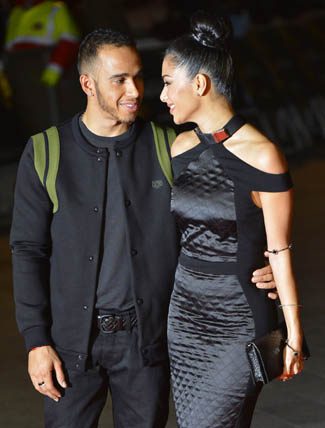 U.S. singer Scherzinger and British Formula One racing driver Hamilton arrive for the world premiere of the film "Jack Reacher" in London