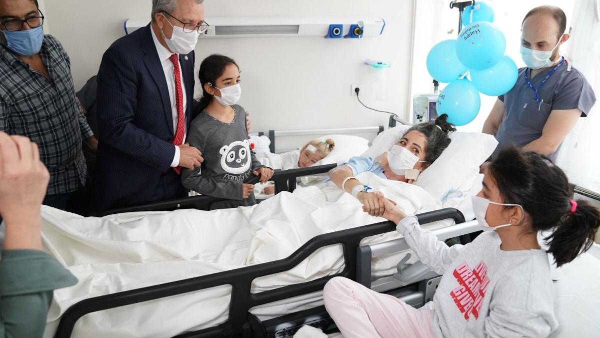 The Perinçek family gathered in the hospital room.